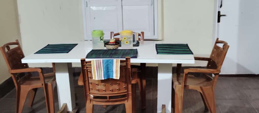 Dining area at Coorg Inn Stay, indulge your taste buds in the rich, aromatic flavors of Kodagu.